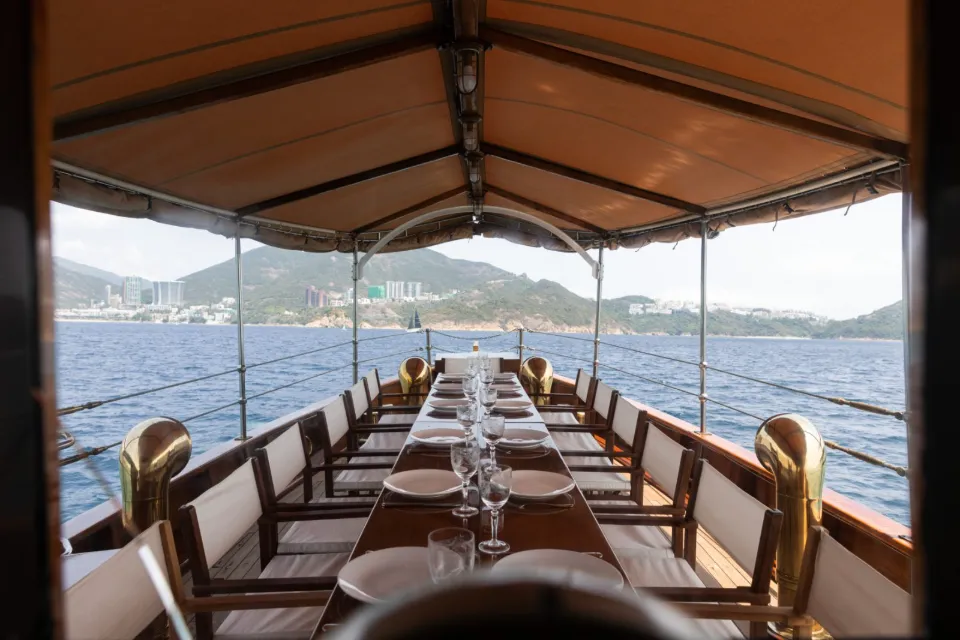 Covered deck of Wayfoong laid for dinner